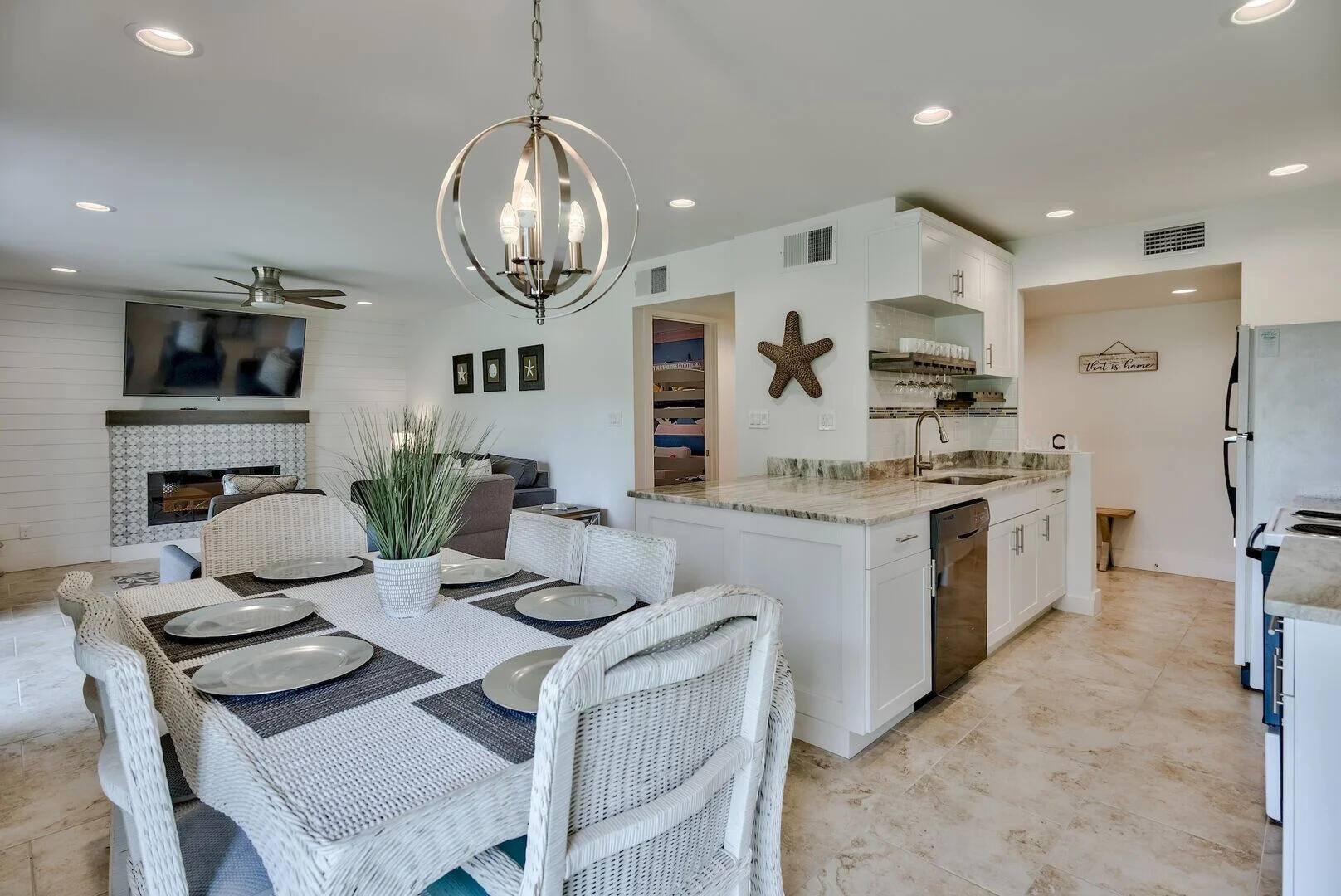 159 Sunset Bay, Unit 23A Miramar Beach, FL 32550 - Photo 11 of 31 a kitchen with a table chairs stove and cabinets