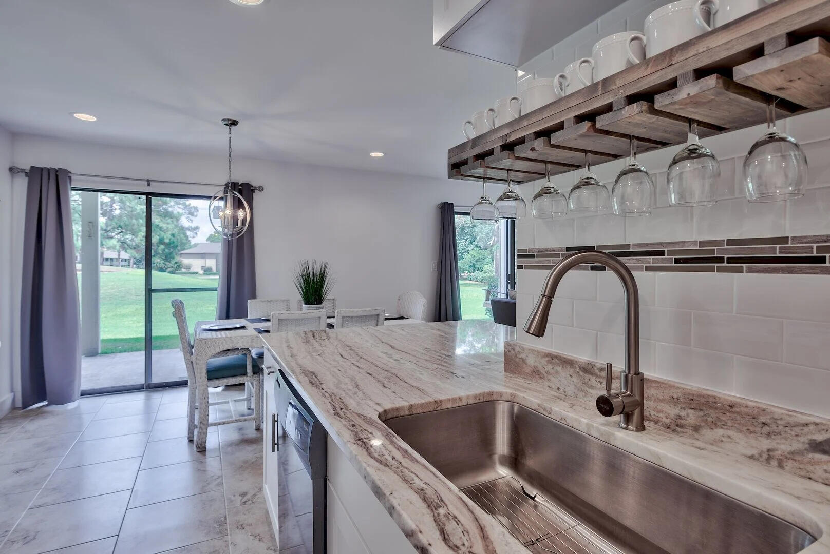 159 Sunset Bay, Unit 23A Miramar Beach, FL 32550 - Photo 13 of 31 a kitchen with a sink a counter top space and appliances