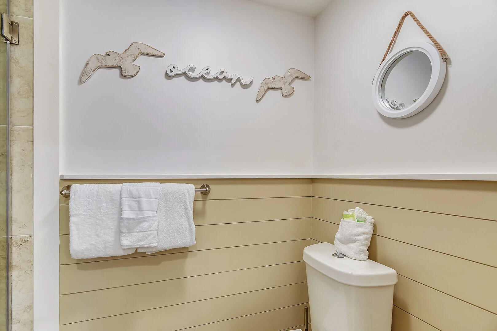 159 Sunset Bay, Unit 23A Miramar Beach, FL 32550 - Photo 17 of 31 a bathroom with a toilet and a mirror