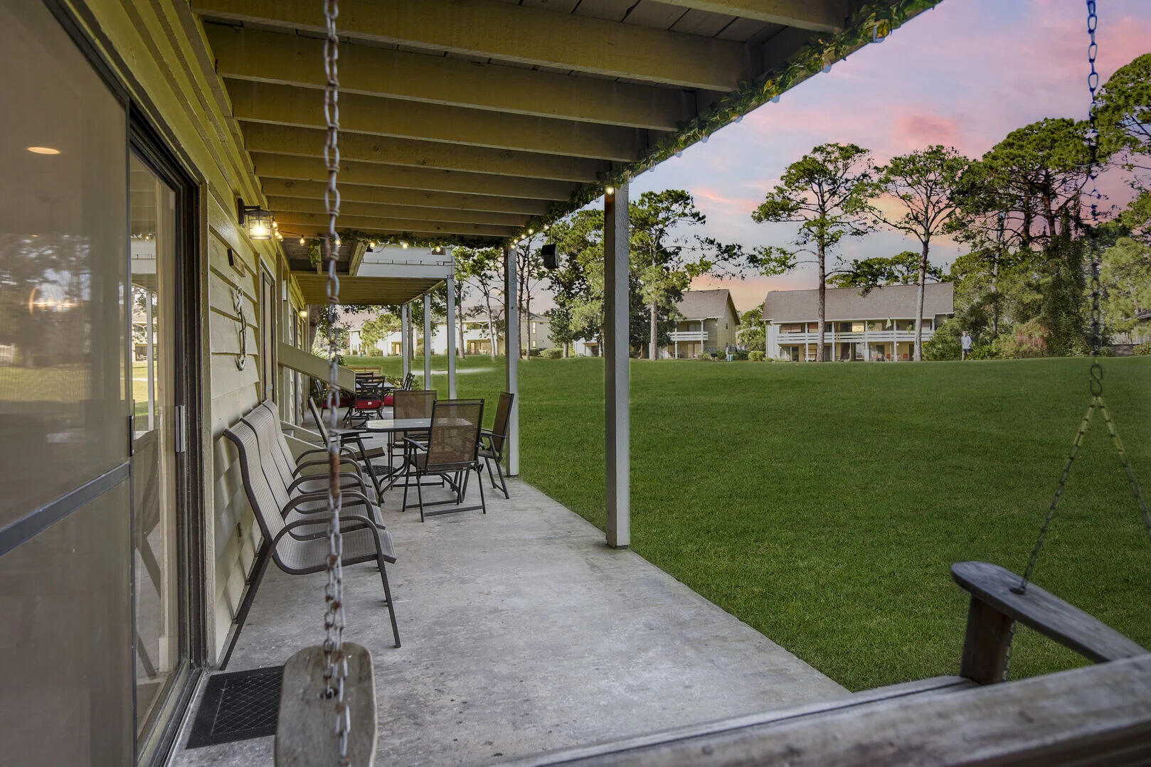 159 Sunset Bay, Unit 23A Miramar Beach, FL 32550 - Photo 22 of 31 a view of a porch with chairs and backyard
