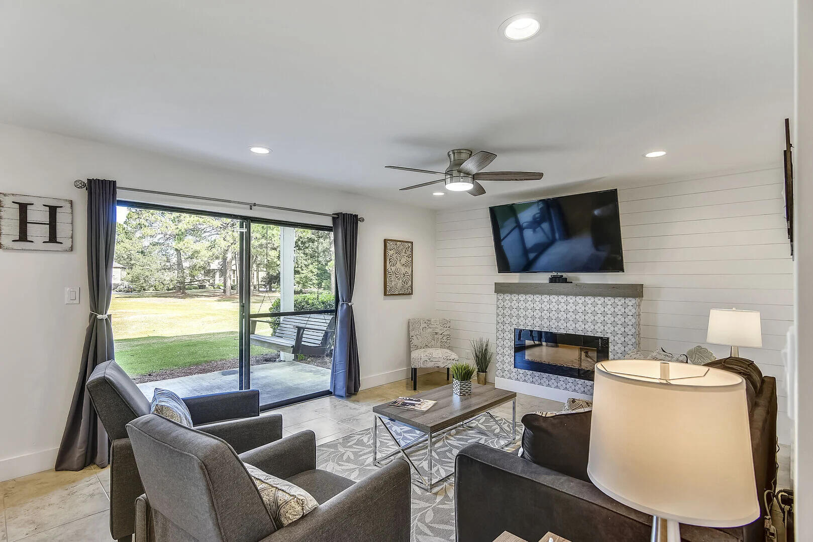 159 Sunset Bay, Unit 23A Miramar Beach, FL 32550 - Photo 9 of 31 a living room with furniture and a fireplace