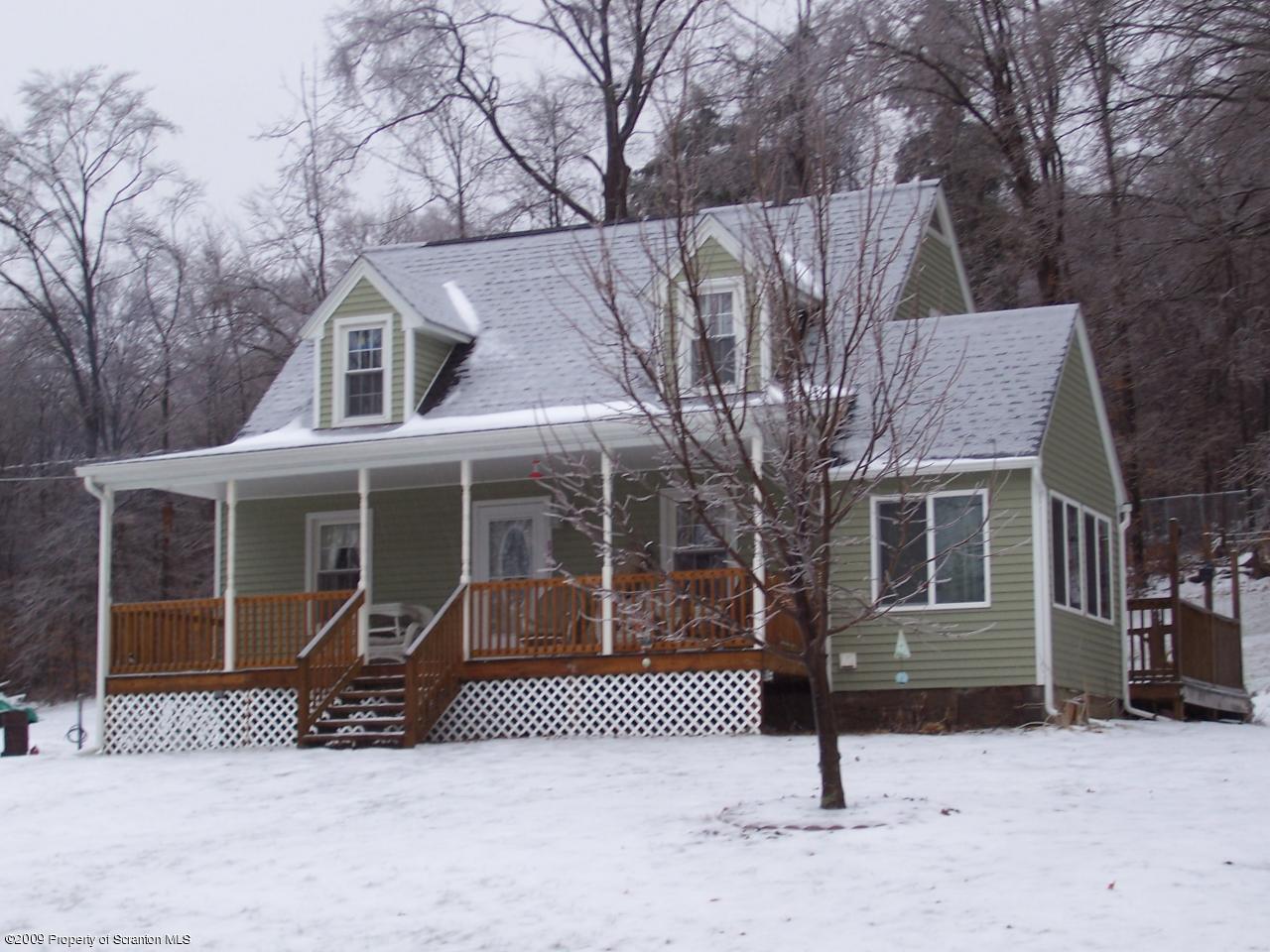 6456 R R, Unit 6 Montrose, PA 18801 - Photo 1 of 10 a view of a house with a snow in the yard