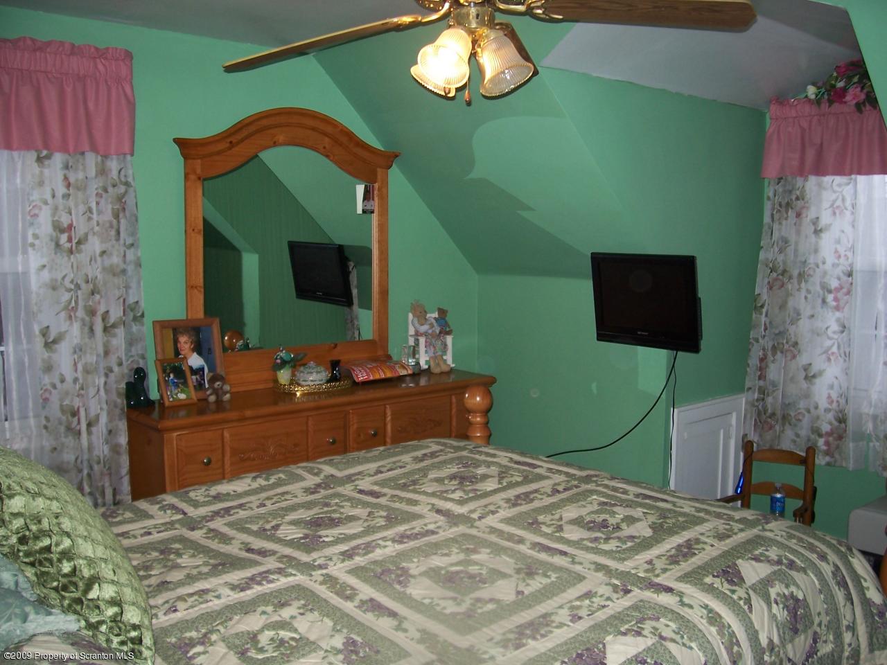 6456 R R, Unit 6 Montrose, PA 18801 - Photo 9 of 10 a bedroom with a bed and a television