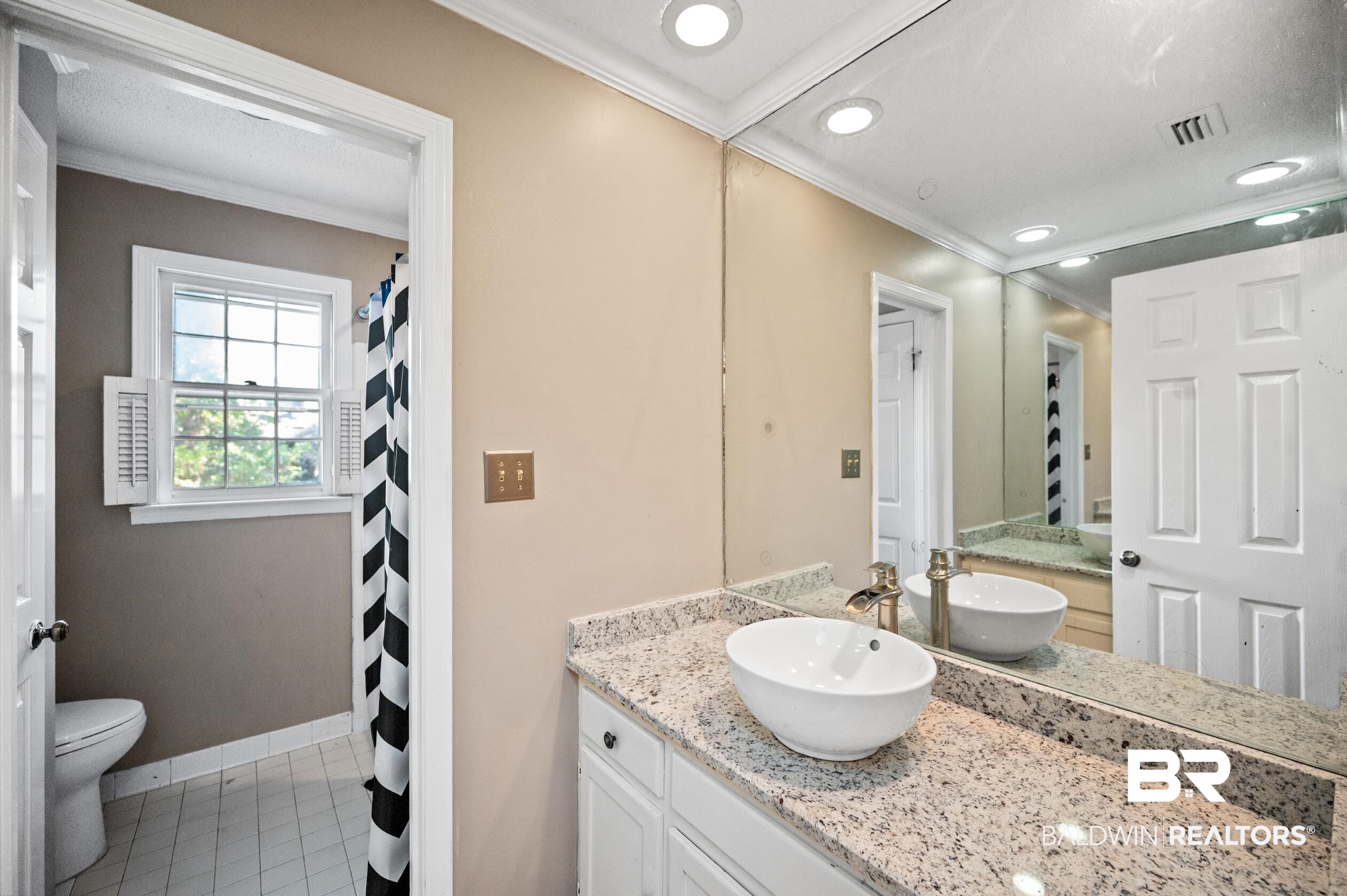 6705 Ridgeland Road South Mobile, AL 36695 - Photo 28 of 44 Bathroom with vanity, toilet, ornamental molding, and tile patterned flooring