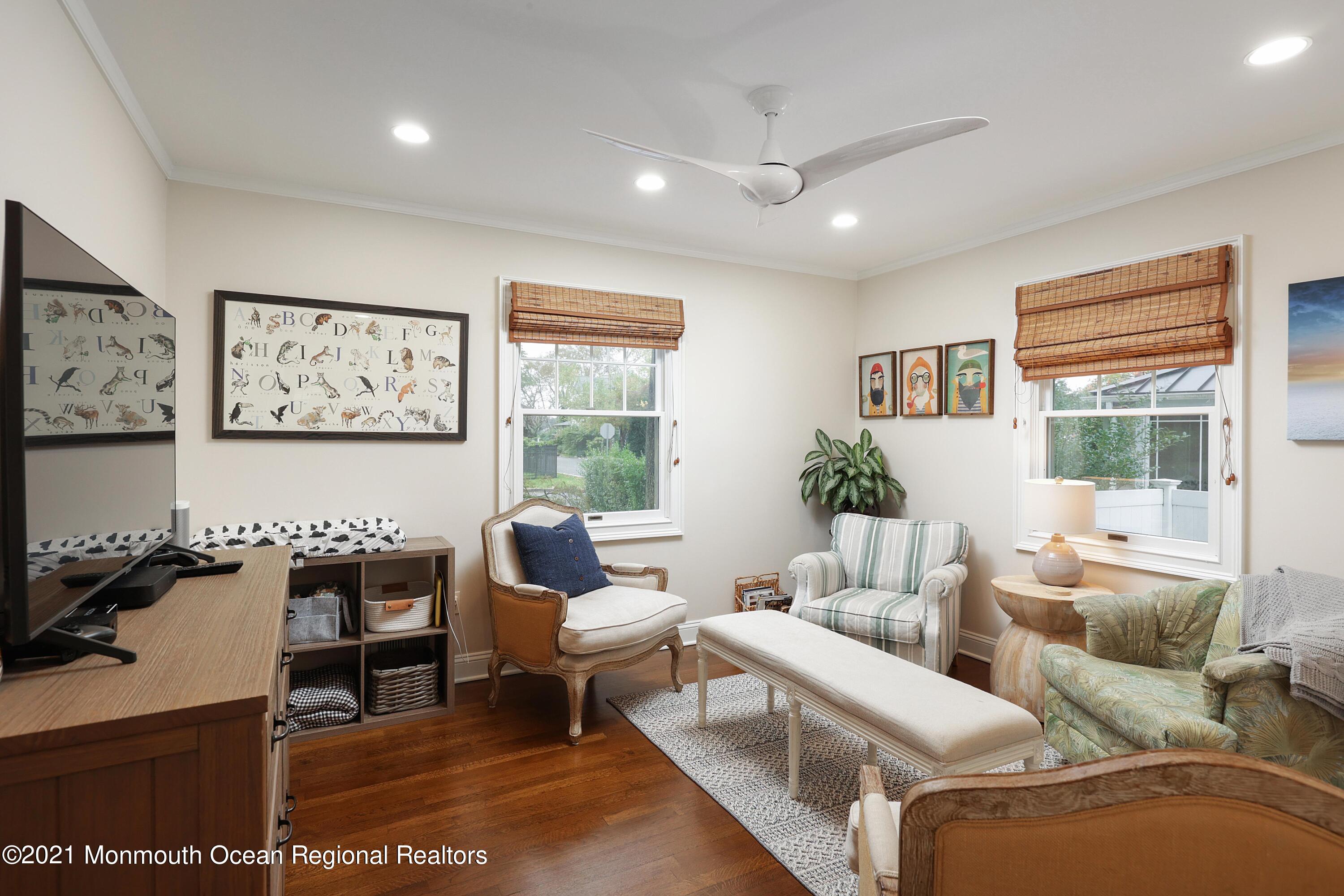 57 River Road Rumson, NJ 07760 - Photo 11 of 34 a living room with furniture and a large window