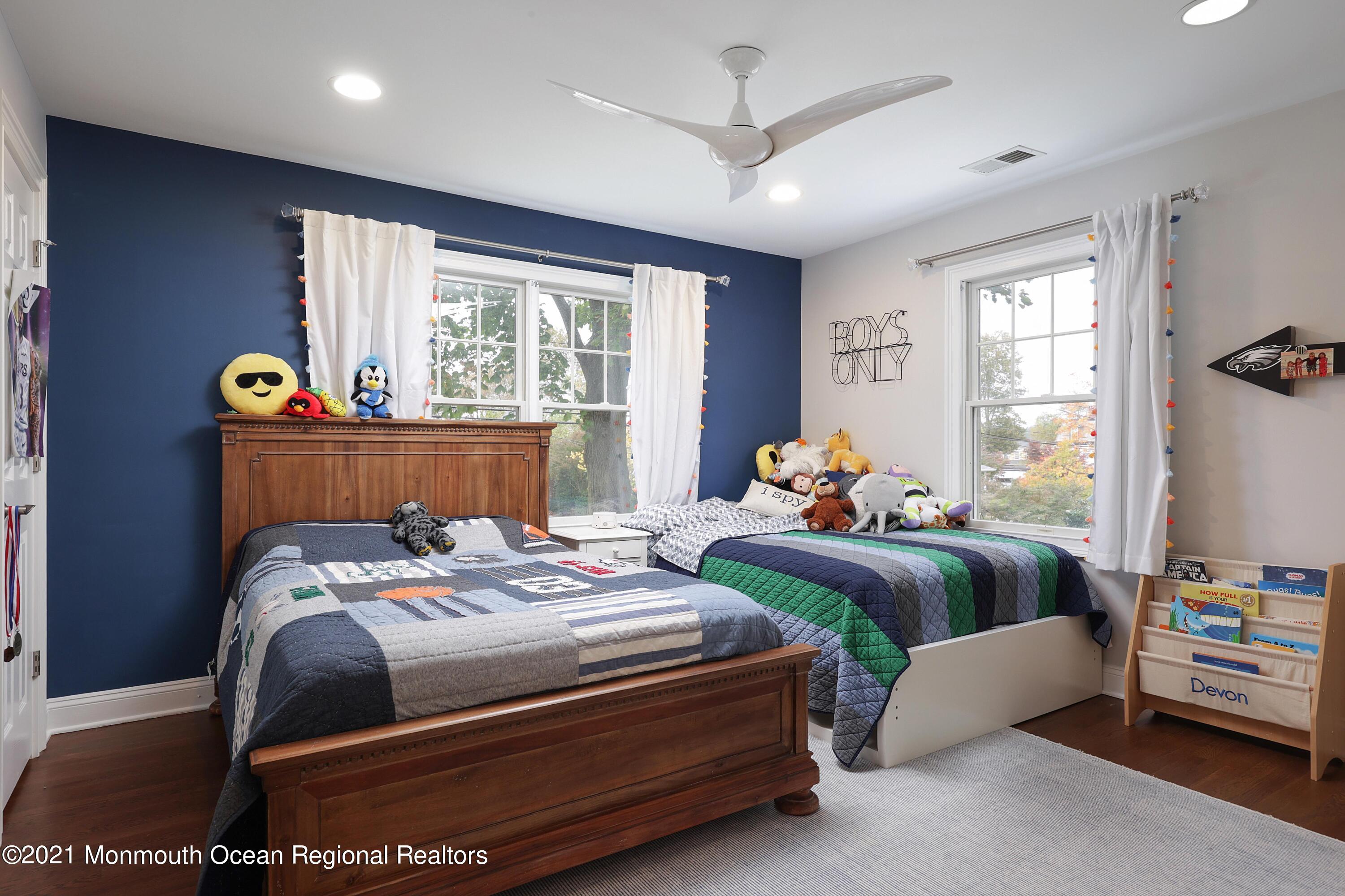 57 River Road Rumson, NJ 07760 - Photo 15 of 34 a bedroom with a bed and a window