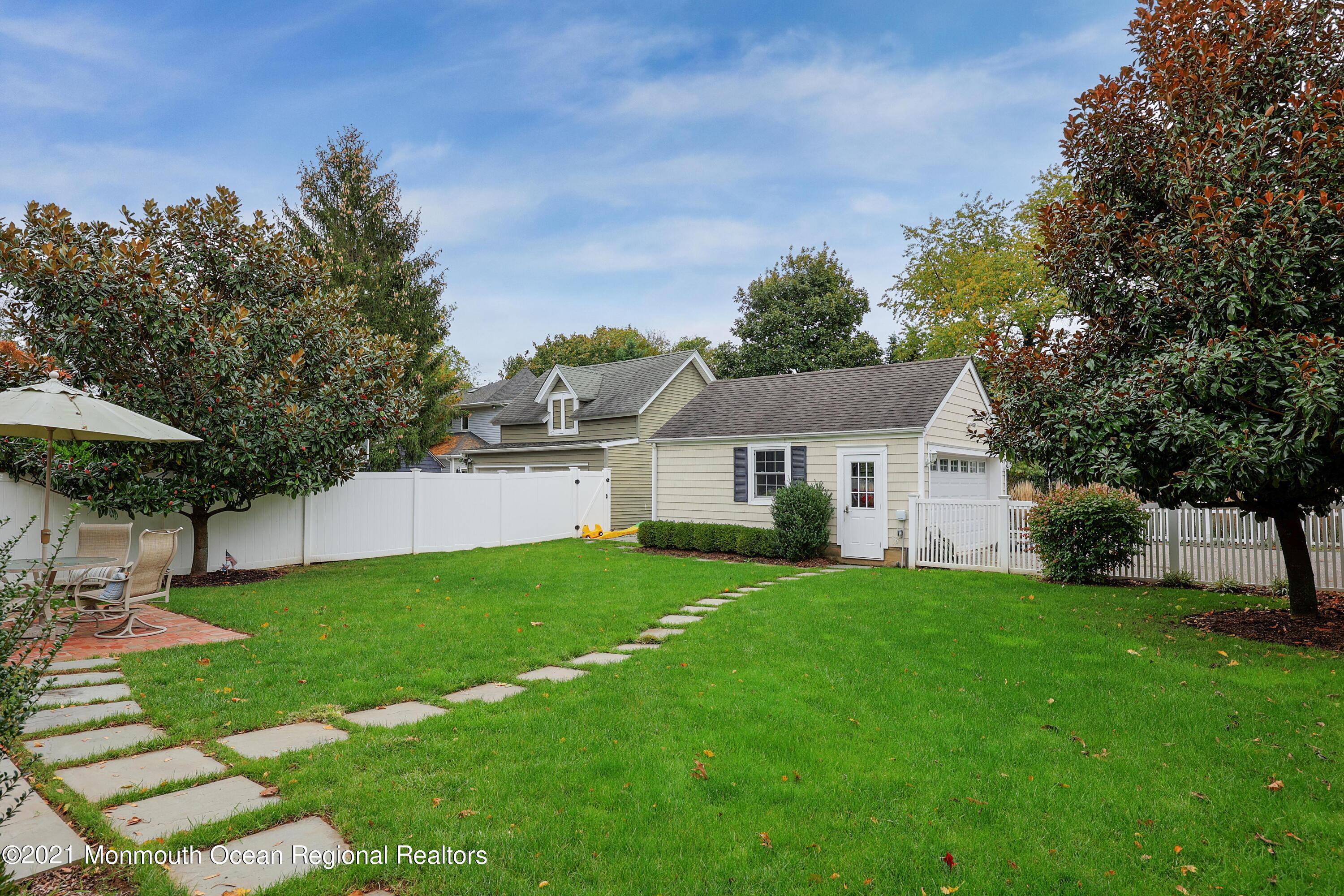 57 River Road Rumson, NJ 07760 - Photo 21 of 34 a view of a house with a yard and sitting area