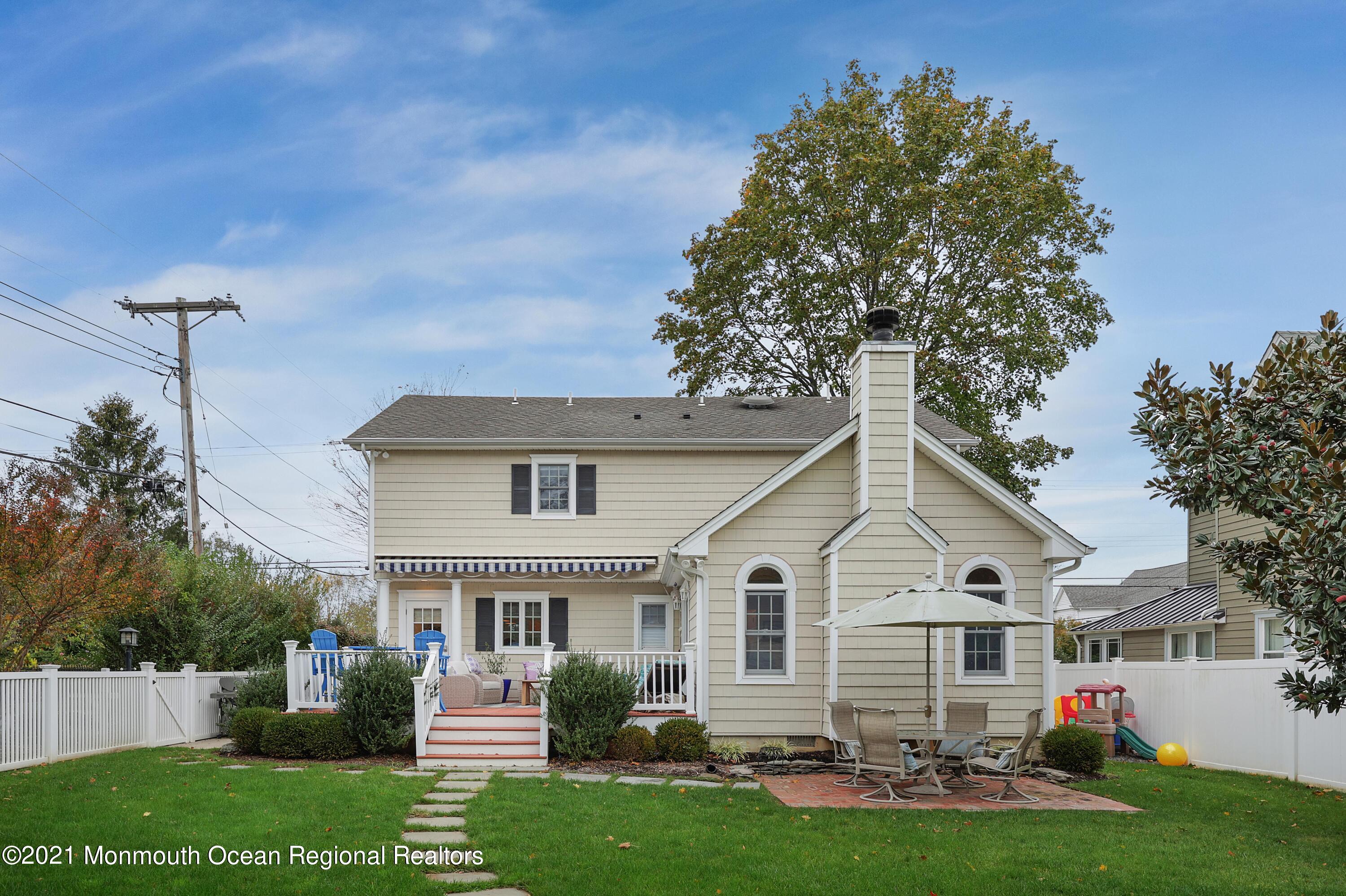 57 River Road Rumson, NJ 07760 - Photo 23 of 34 a view of a house with a yard