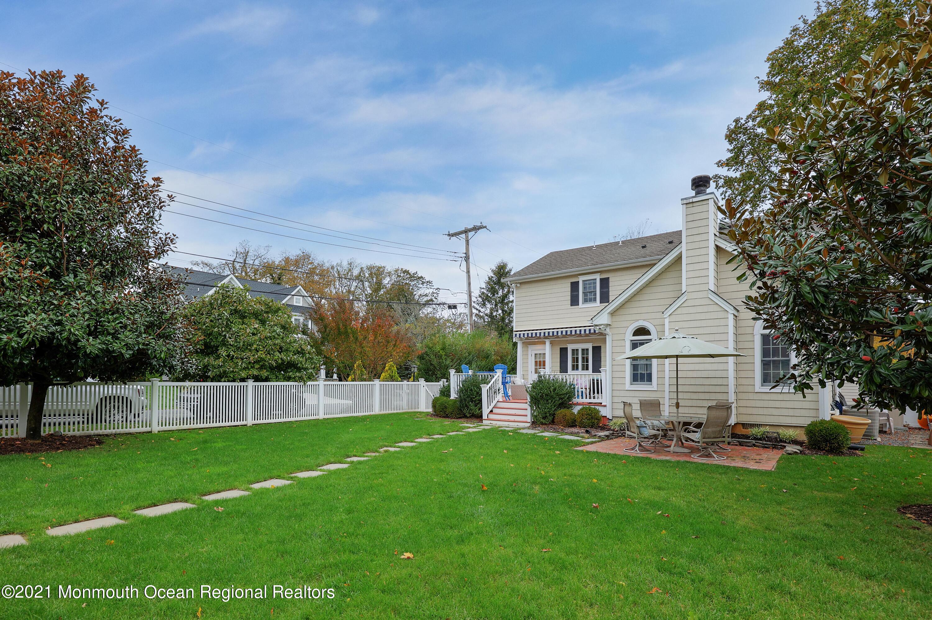 57 River Road Rumson, NJ 07760 - Photo 24 of 34 a front view of house with yard and green space