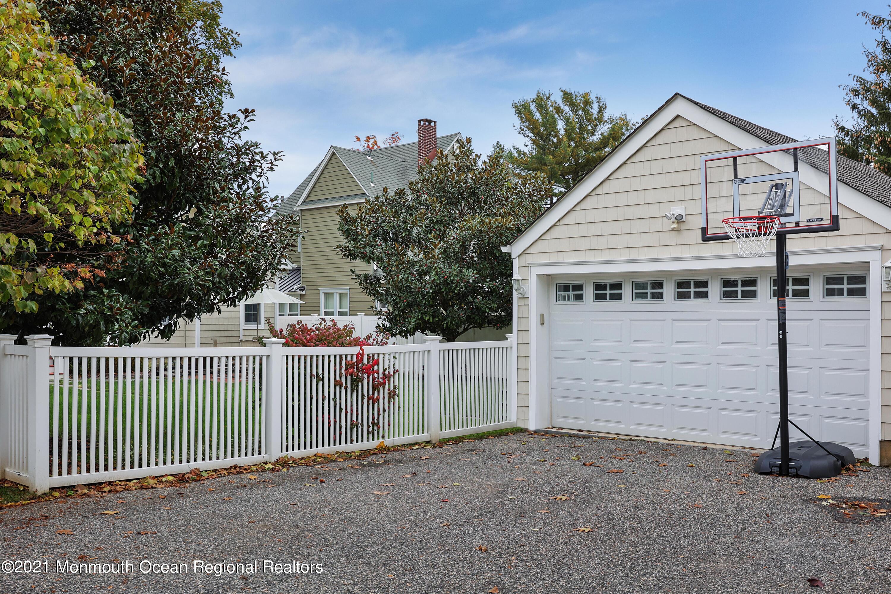 57 River Road Rumson, NJ 07760 - Photo 25 of 34 a view of a house with a wooden fence