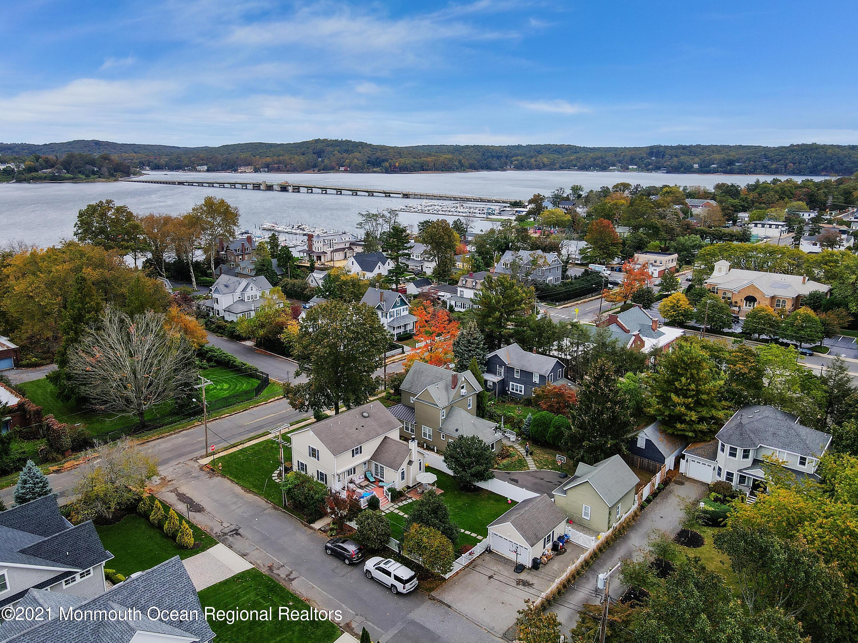 57 River Road Rumson, NJ 07760 - Photo 28 of 34 an aerial view of a city with lots of residential buildings ocean and mountain view in back