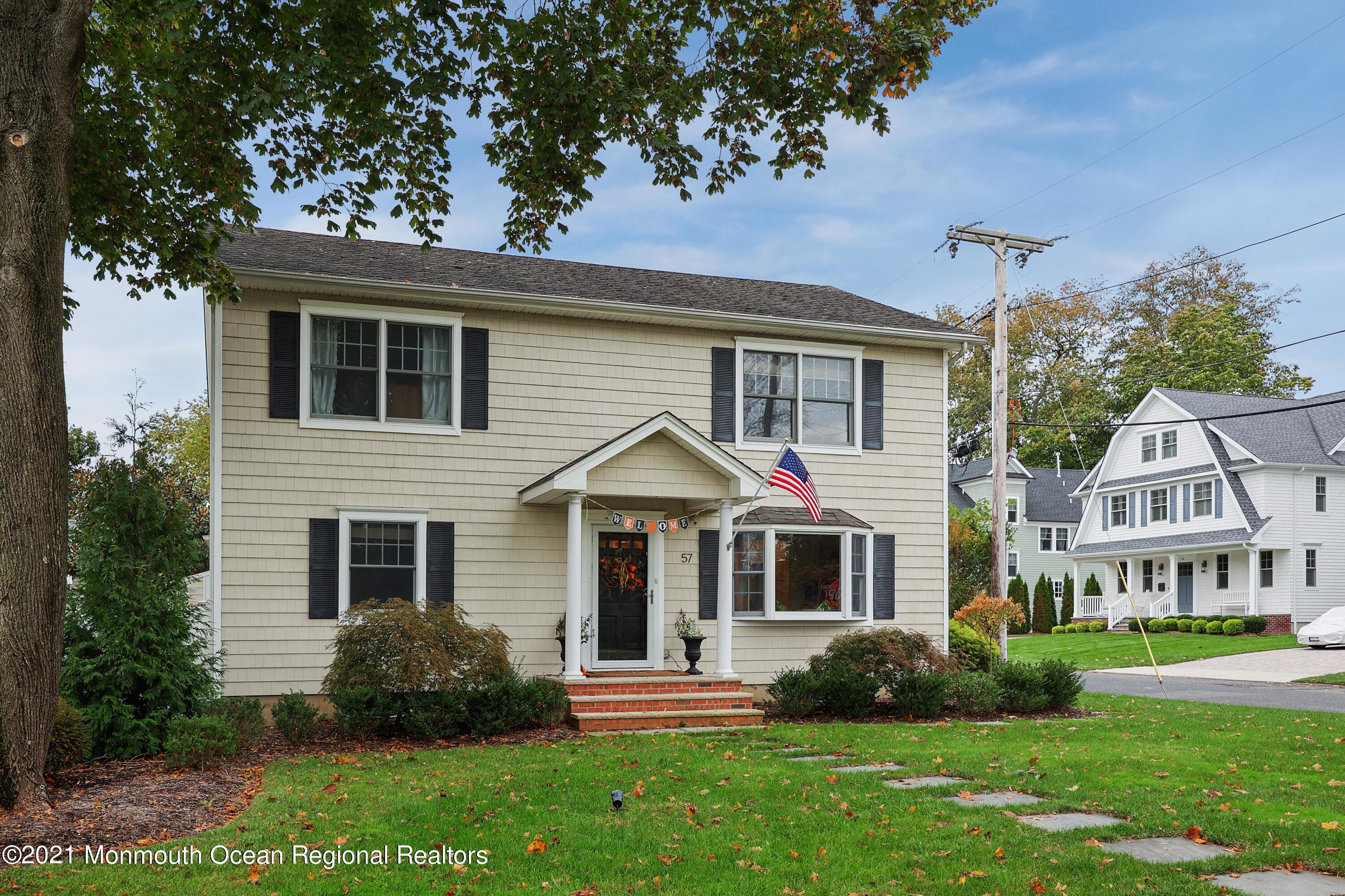 57 River Road Rumson, NJ 07760 - Photo 34 of 34 a front view of a house with a yard
