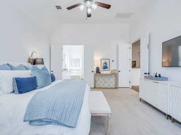 a bedroom with furniture and a large bed