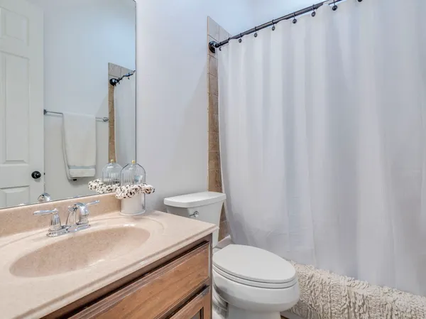 a bedroom with a bed and a table