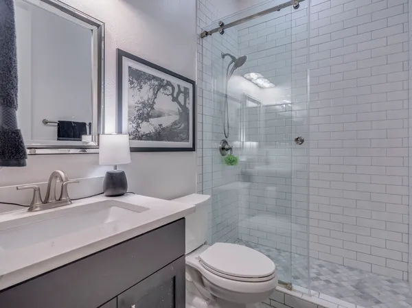 a bed room with a bed and a chair