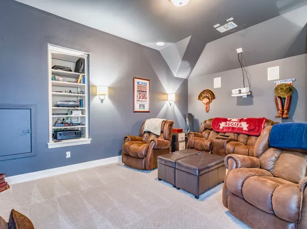 a bathroom with a granite countertop sink and a toilet