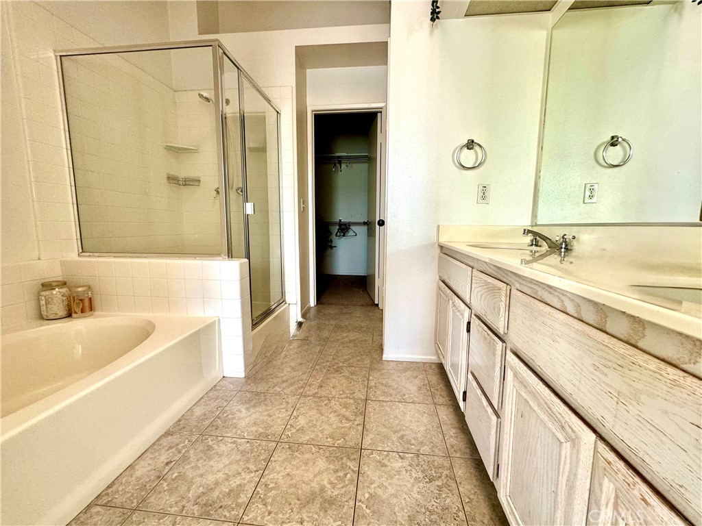 2275 Indigo Hills Drive, Unit 4 Corona, CA 92879 - Photo 6 of 9 a spacious bathroom with a tub sink shower and mirror