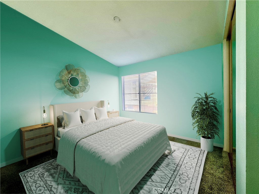 2275 Indigo Hills Drive, Unit 4 Corona, CA 92879 - Photo 9 of 9 a bedroom with a bed and a potted plant
