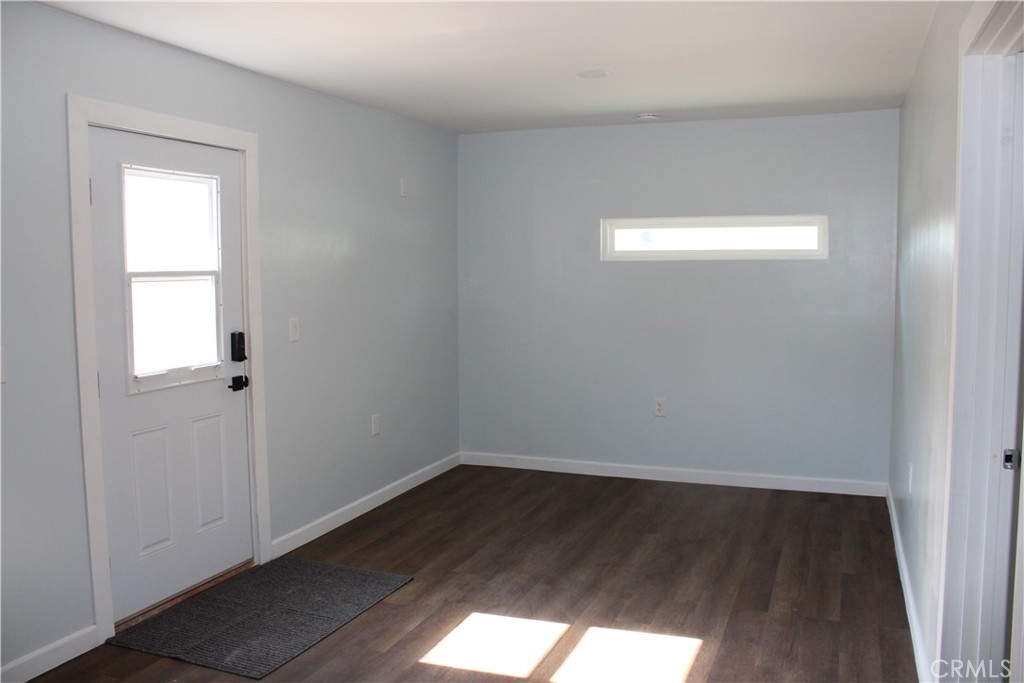 5776 Katherine Street Simi Valley, CA 93063 - Photo 2 of 15 an empty room with wooden floor and windows