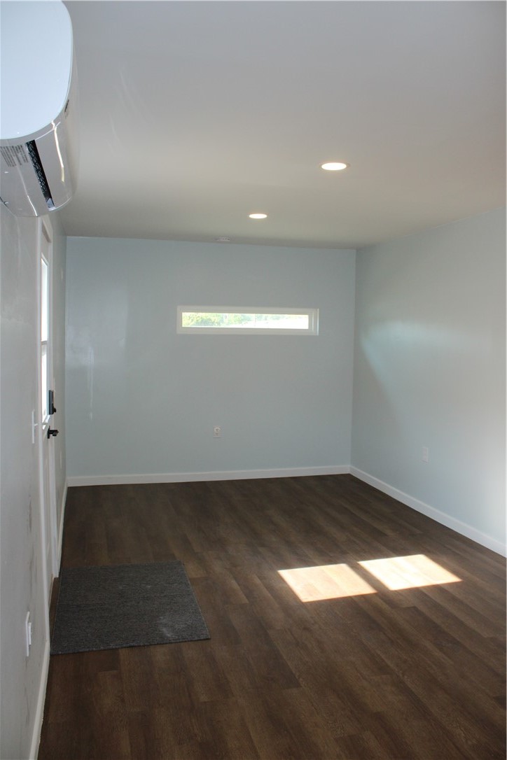 5776 Katherine Street Simi Valley, CA 93063 - Photo 3 of 15 an empty room with wooden floor and windows