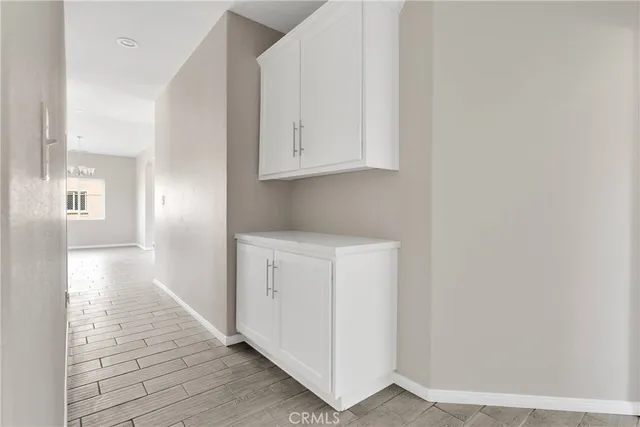 a view of an entryway with wooden floor