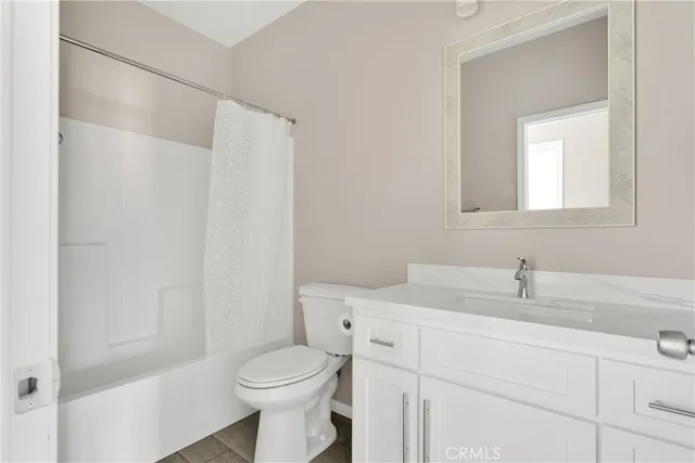a bathroom with a sink toilet and vanity