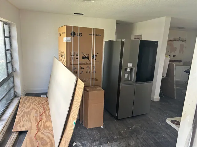 a view of a workspace with furniture