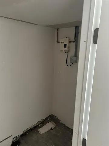 a bed room with a bed and a chair