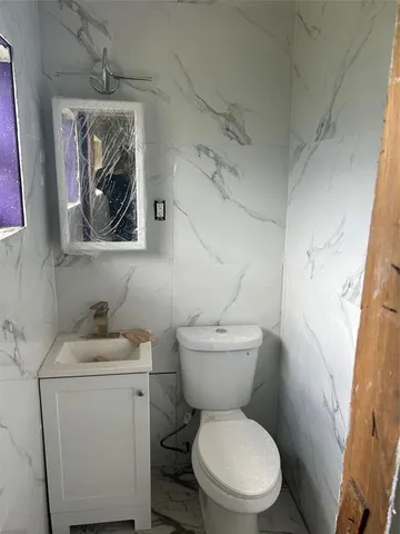 a room that has a window and a wooden floor