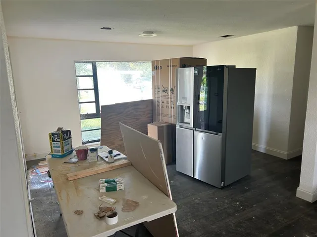 a view of hallway with wooden floor