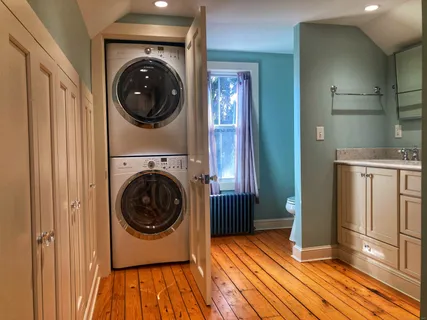 a view of a hallway with washer and dryer