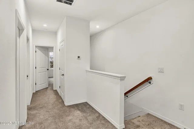 a view of a hallway with closet