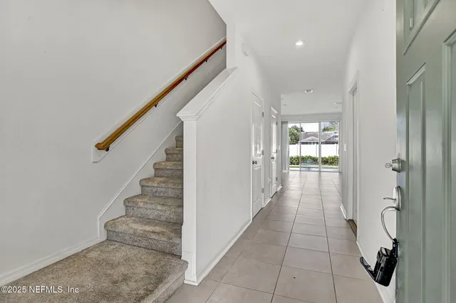 a view of entryway and hall with a hallway