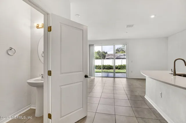 a bathroom with a granite countertop sink a toilet and a shower