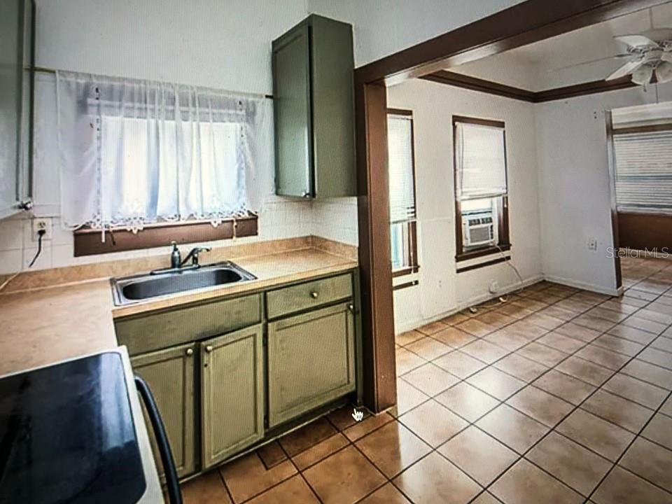 941 Lakeview Road Clearwater, FL 33756 - Photo 17 of 20 a kitchen with a sink cabinets and window