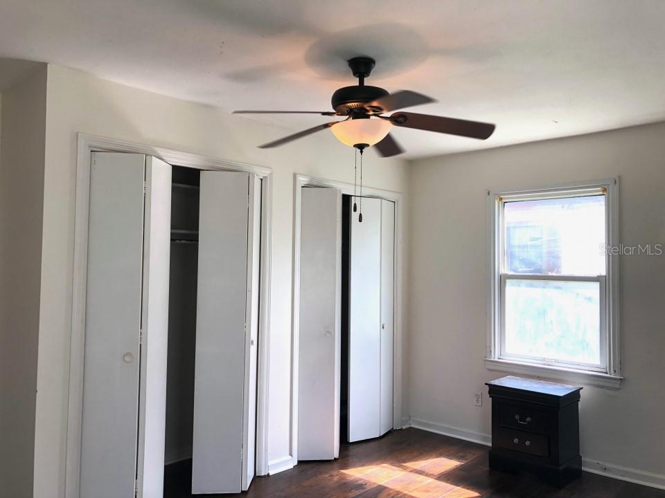 941 Lakeview Road Clearwater, FL 33756 - Photo 4 of 20 a view of a room with a ceiling fan and a window