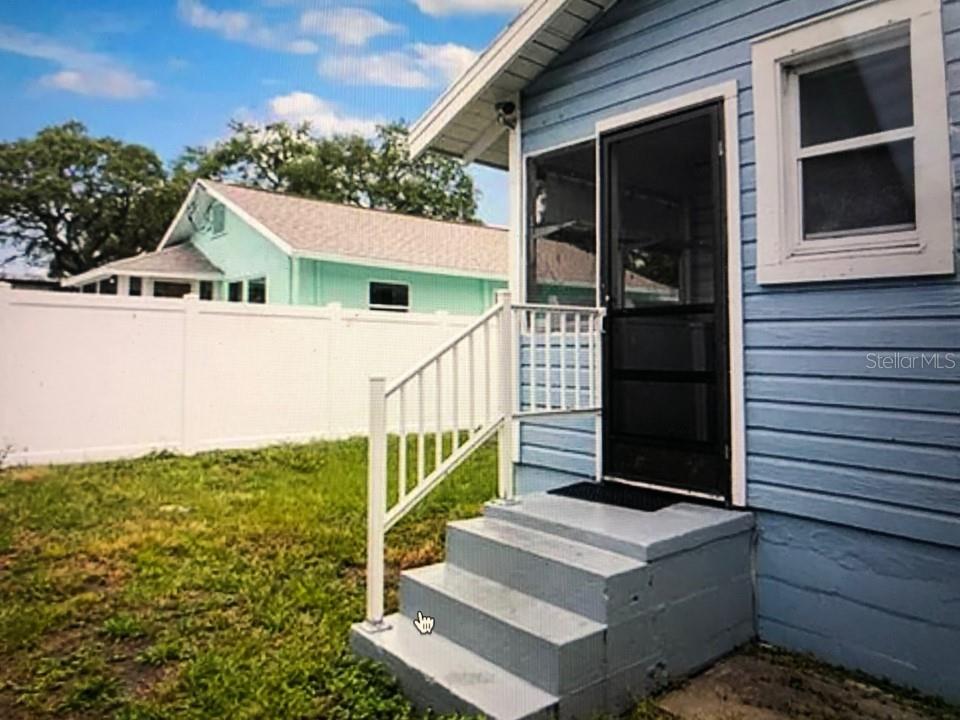 941 Lakeview Road Clearwater, FL 33756 - Photo 9 of 20 a view of house with front door and wooden floor
