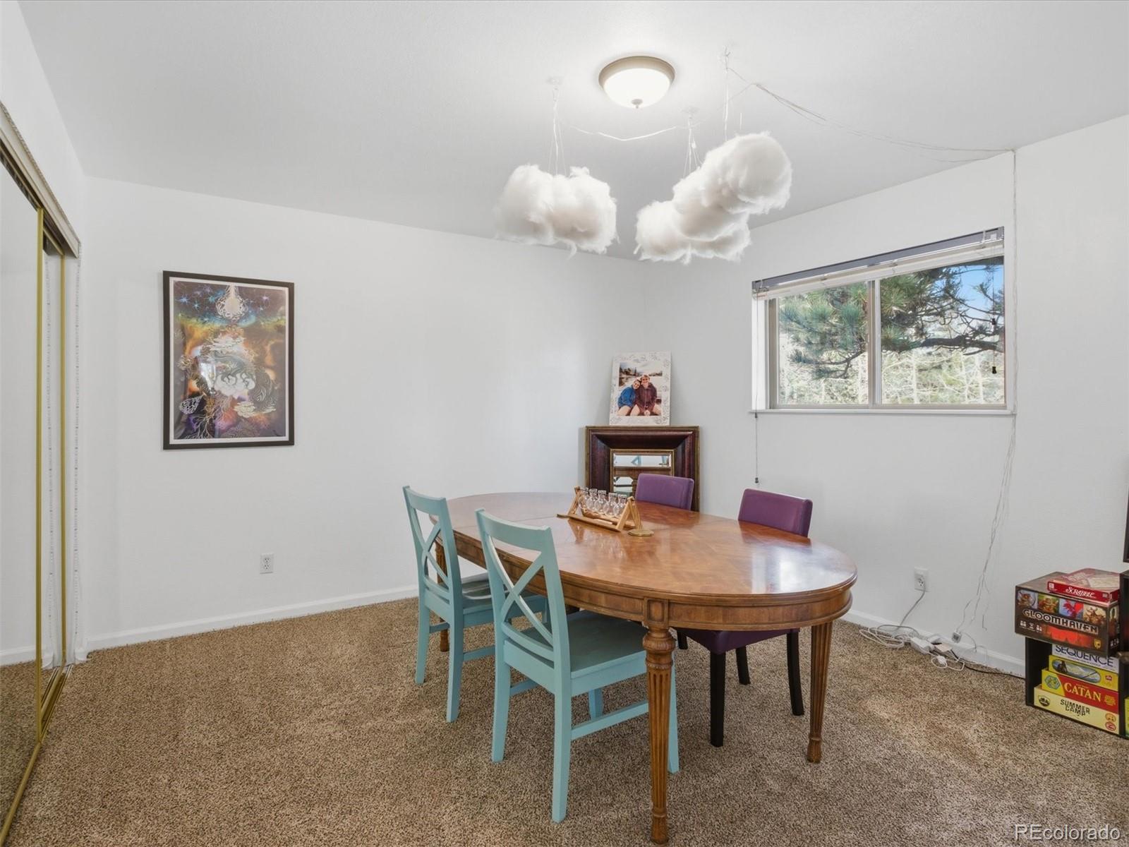 209 Pine Drive Bailey, CO 80421 - Photo 20 of 48 a dining room with furniture and window