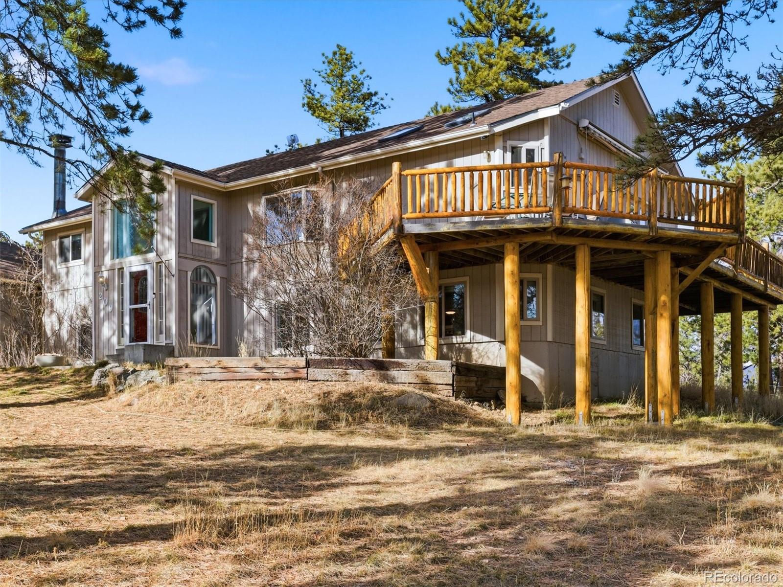 209 Pine Drive Bailey, CO 80421 - Photo 2 of 48 a front view of a house