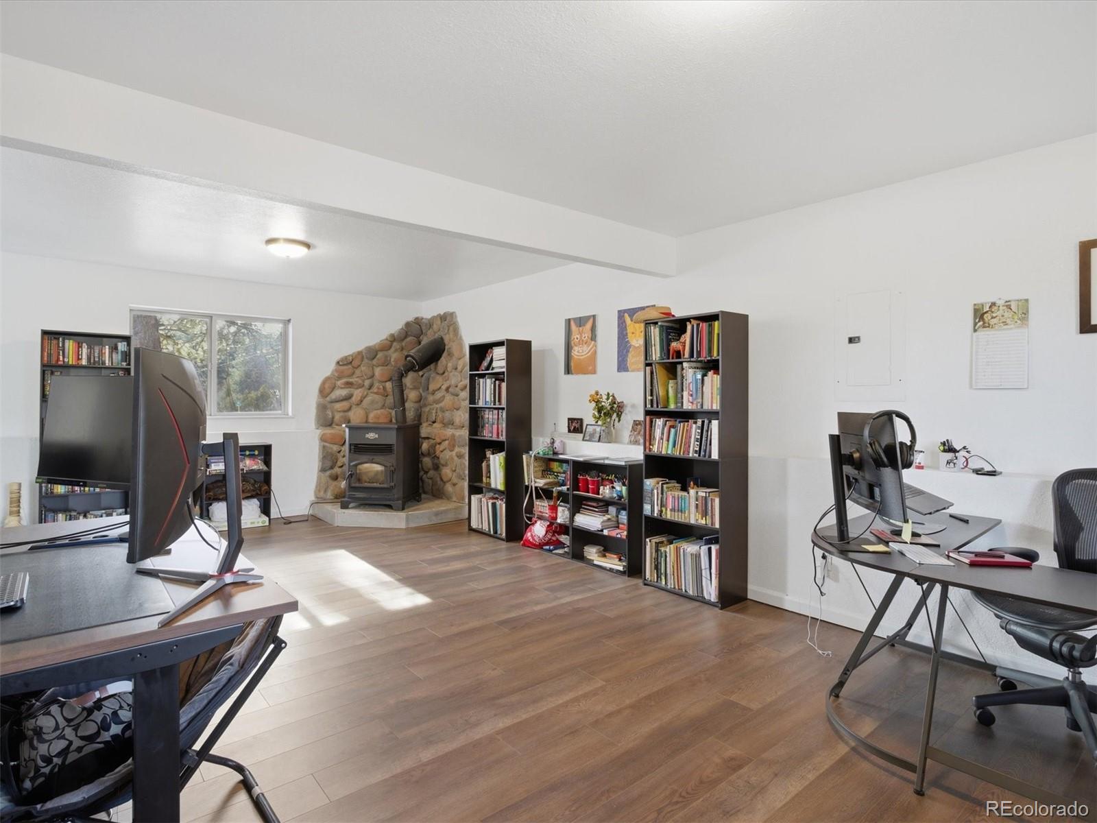 209 Pine Drive Bailey, CO 80421 - Photo 25 of 48 a view of a livingroom with workspace and a couch