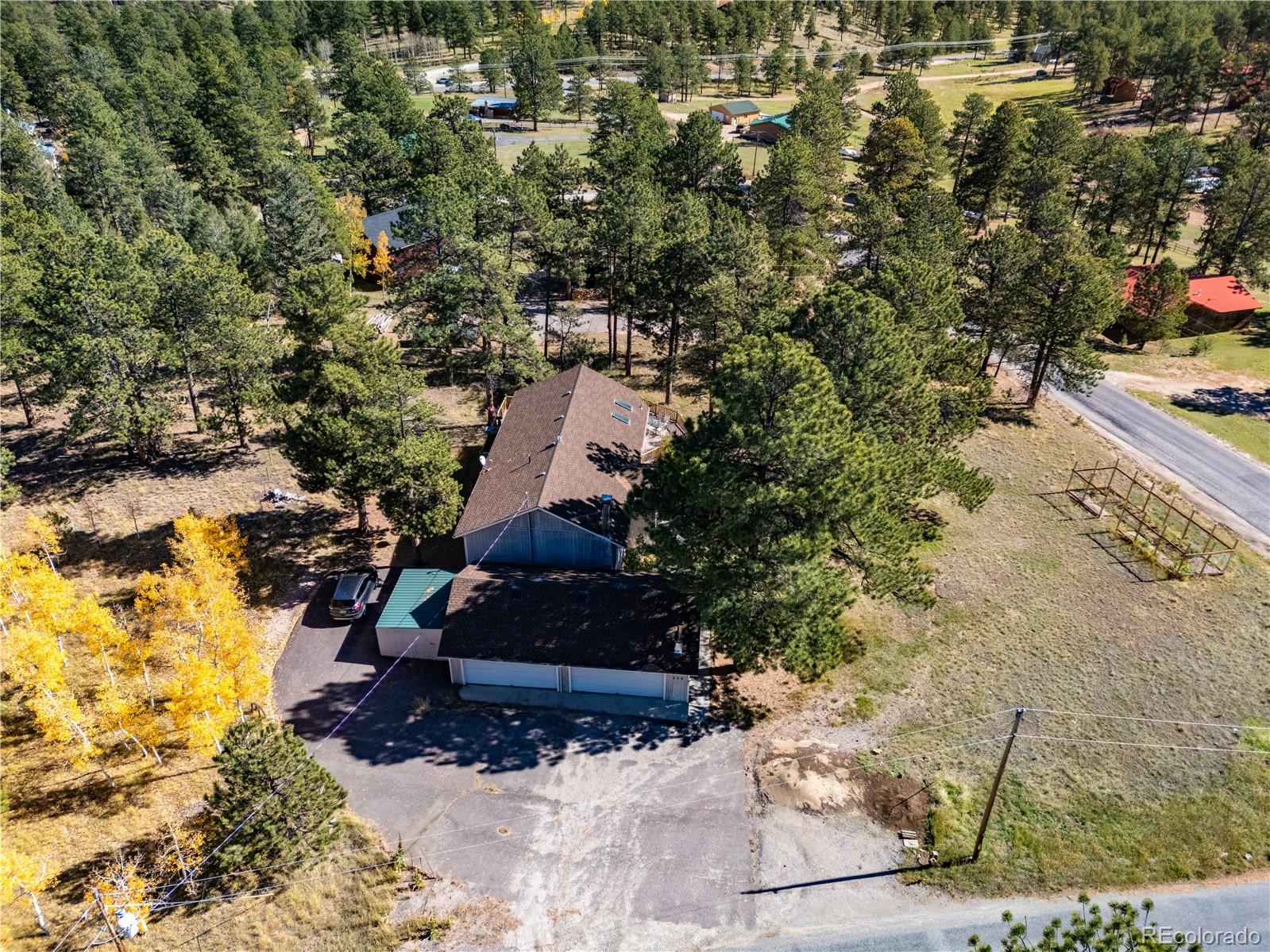 209 Pine Drive Bailey, CO 80421 - Photo 38 of 48 a building outdoor space with lots of trees
