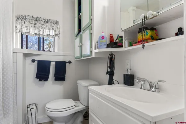 a bathroom with a sink and a toilet