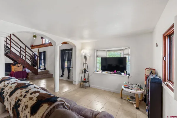 a living room with furniture and a flat screen tv