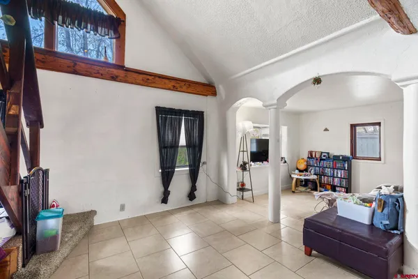a living room with furniture and a fireplace