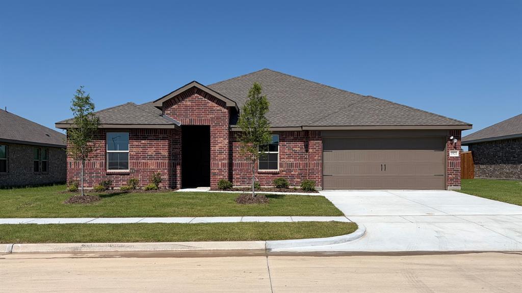 1921 Reveille Way Terrell, TX 75160 - Photo 26 of 30 a front view of a house with a yard