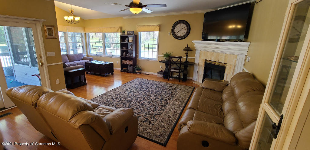129 Bald Mountain Road Wilkes Barre, PA 18702 - Photo 12 of 40 a living room with furniture and a fireplace
