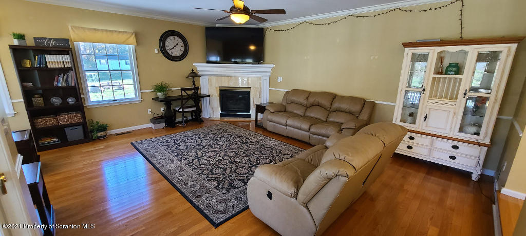 129 Bald Mountain Road Wilkes Barre, PA 18702 - Photo 14 of 40 a living room with furniture and a fireplace