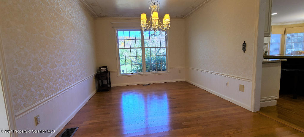 129 Bald Mountain Road Wilkes Barre, PA 18702 - Photo 15 of 40 a view of an empty room with wooden floor and a window