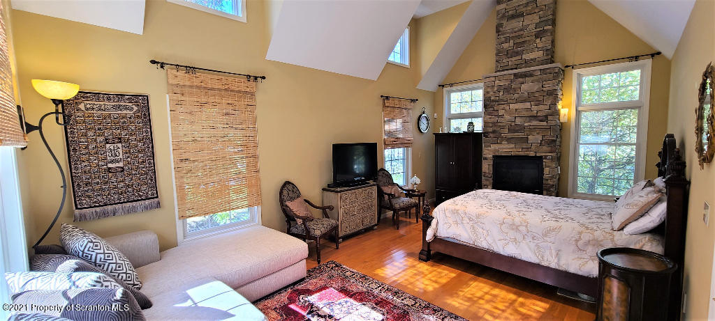 129 Bald Mountain Road Wilkes Barre, PA 18702 - Photo 18 of 40 a bedroom with furniture and a fireplace