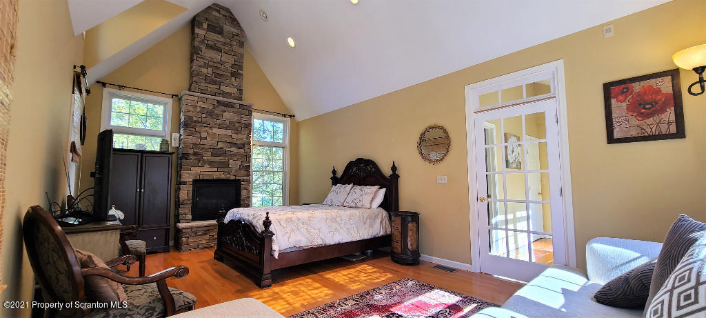 129 Bald Mountain Road Wilkes Barre, PA 18702 - Photo 19 of 40 a spacious bedroom with a bed and wooden floor